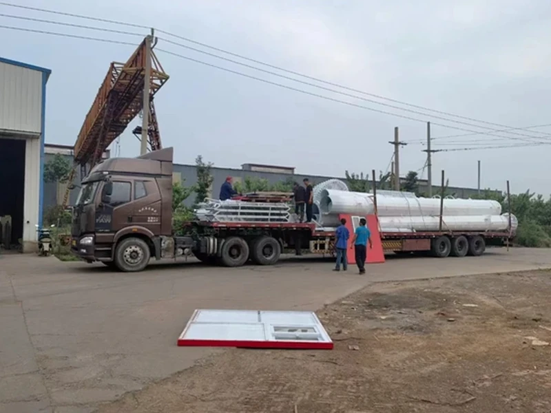 Steel tower components being loaded for delivery