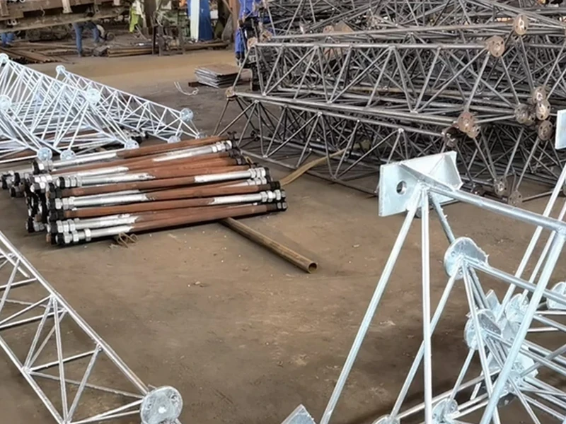 Galvanized lattice tower sections stored in the production workshop
