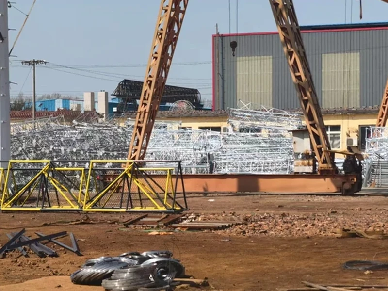 Steel tower components stored in the factory yard