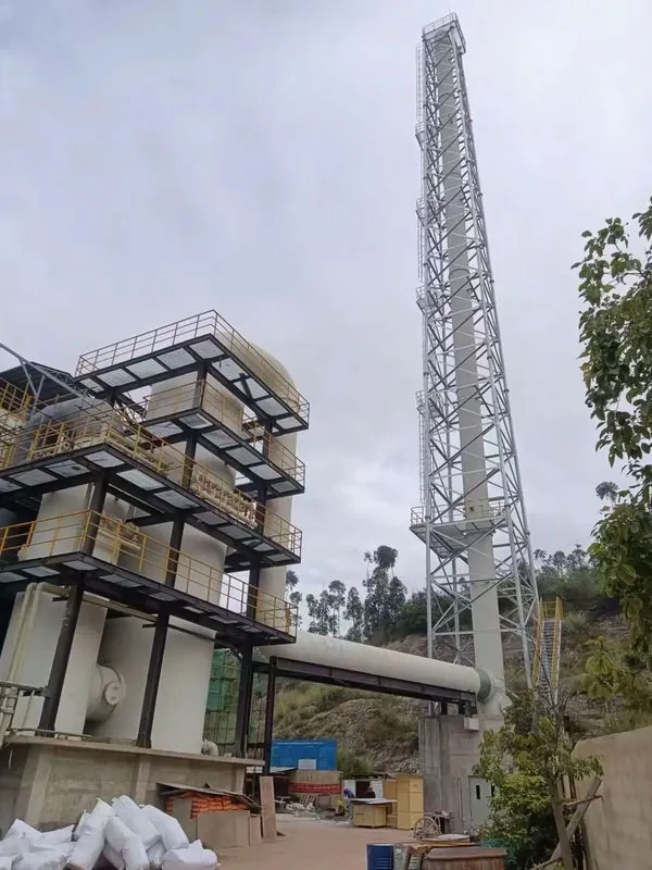 Completed galvanized chimney support tower beside a flue gas duct
