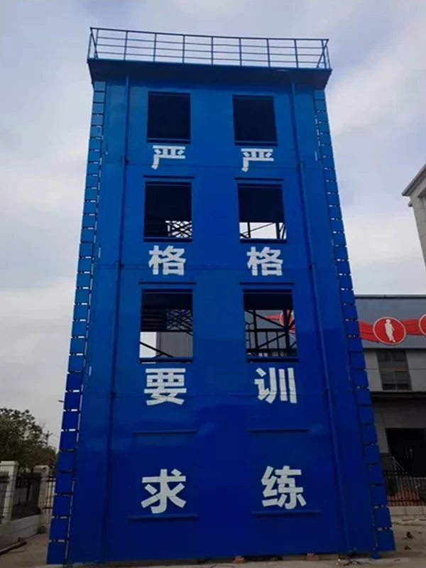 Blue enclosed fire training tower with stacked practice windows, side ladders and guarded roof platform