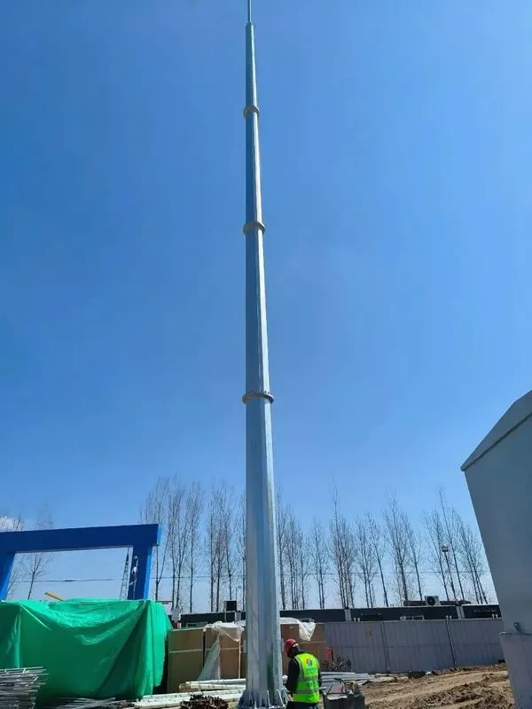 Monopole lightning mast being installed at an industrial site
