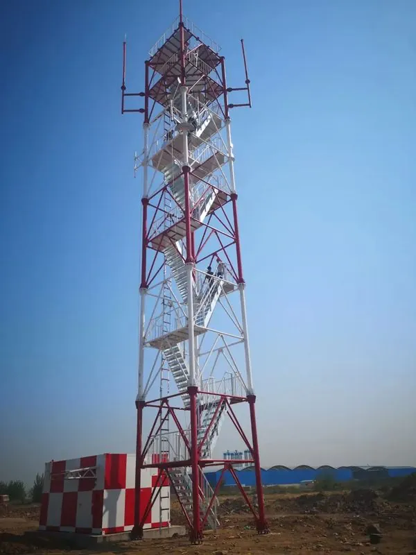 Red and white lattice observation tower with internal stairs