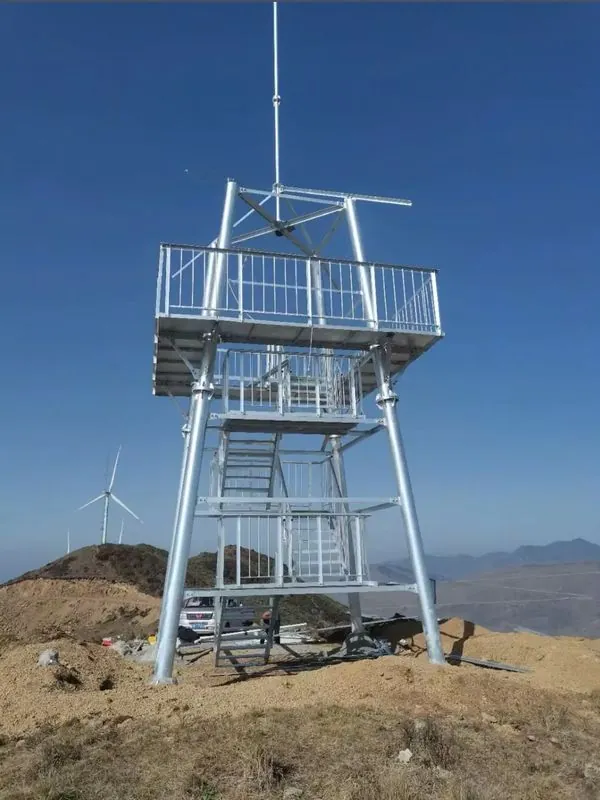 Galvanized lookout tower installed on an exposed mountain ridge