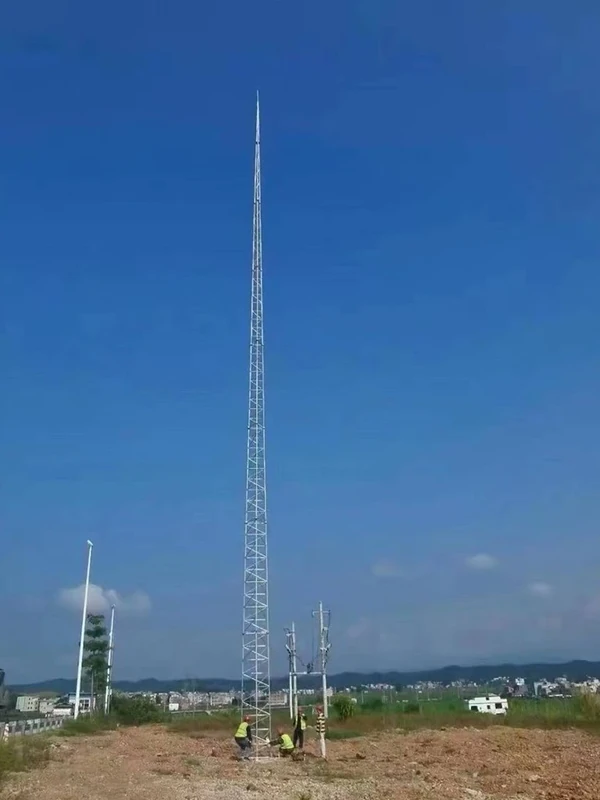 Tall tubular lattice lightning protection tower installed on open ground