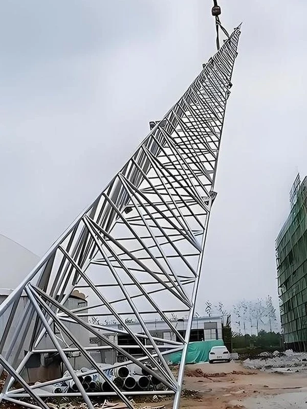 Tubular lattice lightning protection tower section positioned for ground assembly at a construction site