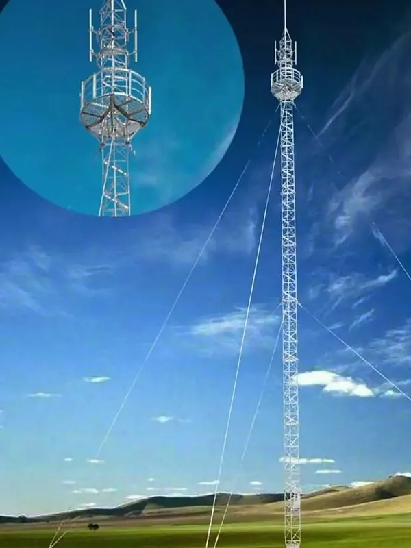Guyed wind measurement tower installed on open grassland with a close view of the mast top